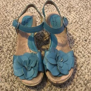 Blue and beige floral boc brand wedges in a woman’s size 7